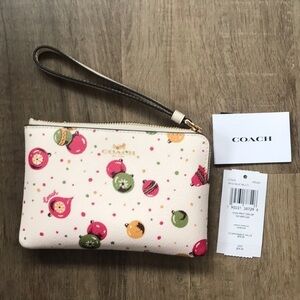 Coach Corner zip wristlet with ornament print